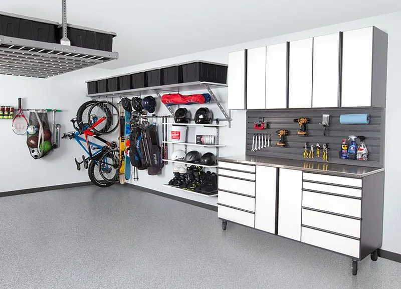 white cabinets with light grey epoxy flooring. 