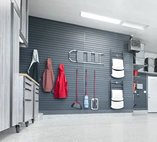 grey garage slatwall with items hanging from it. 