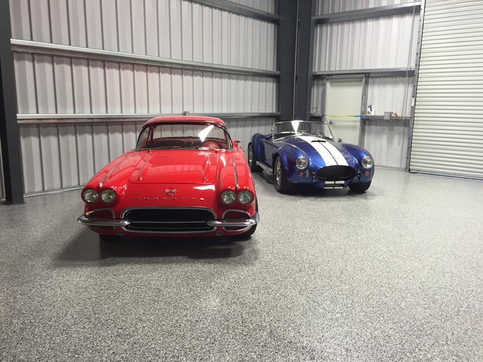 Classic cars parked on epoxy flooring. 