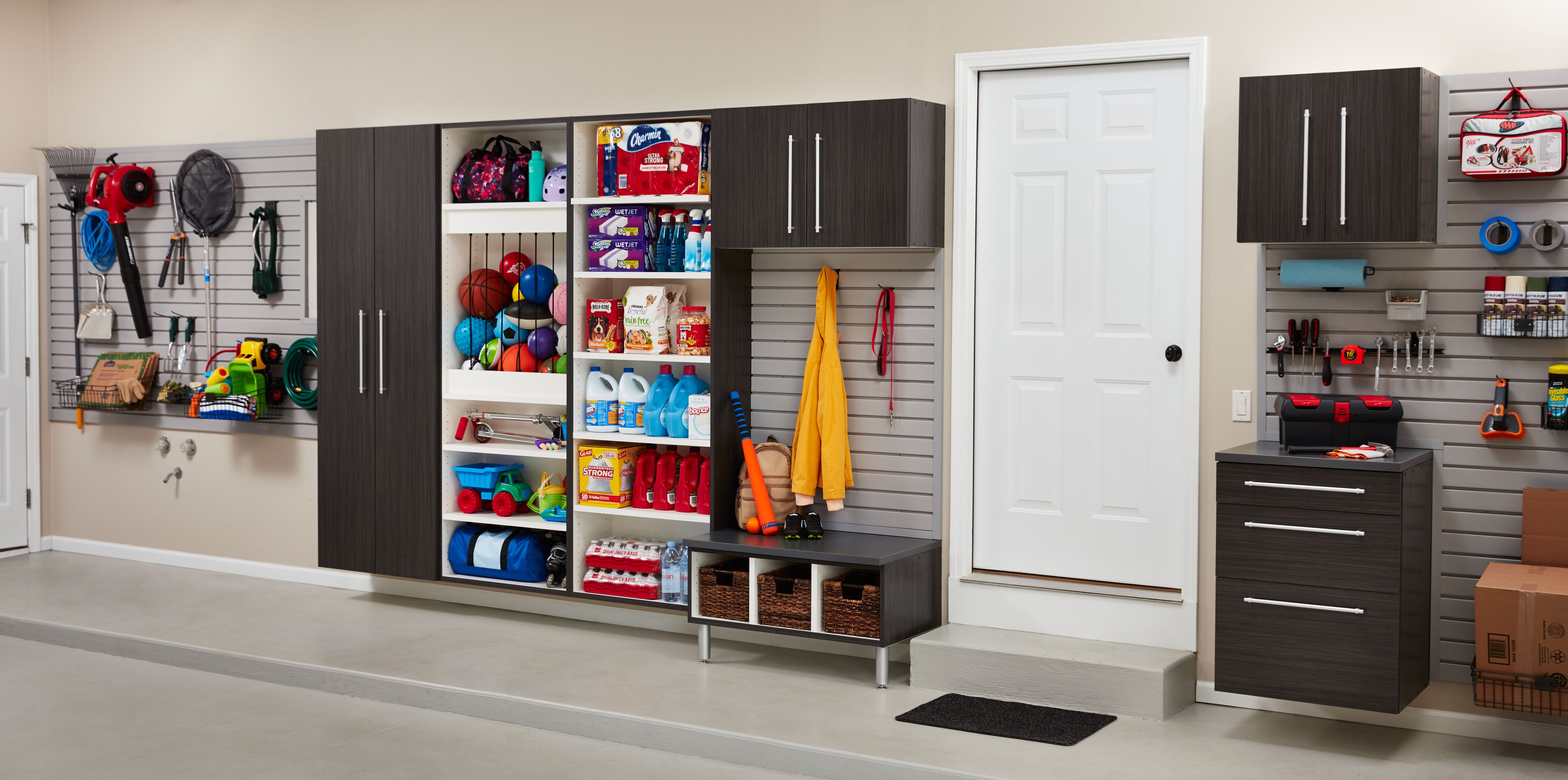 Brown cabinets with items in the shelves.  