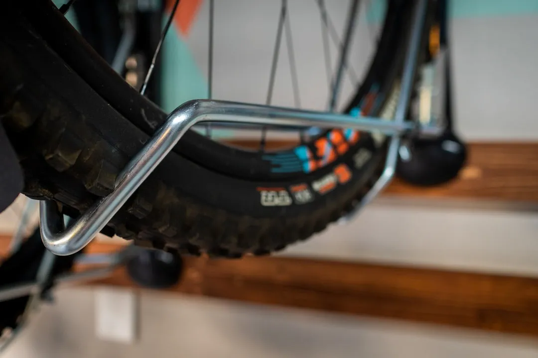 Close up of steady bike rack holding a bike. 