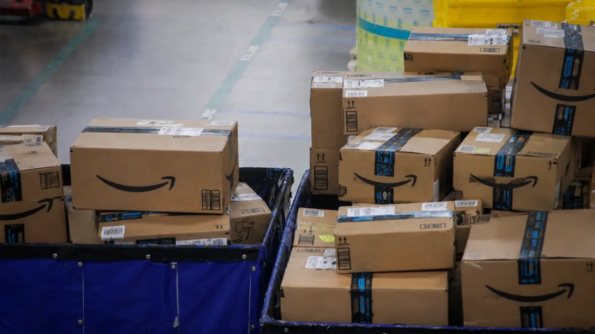 Amazon warehouse with stacked shipping boxes