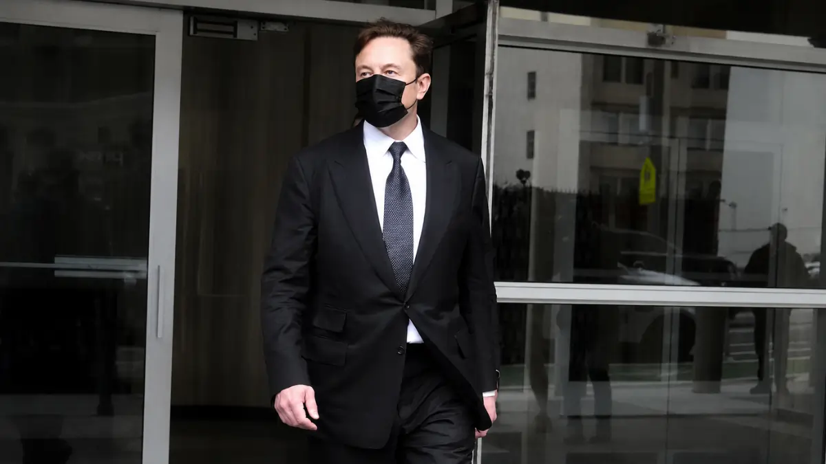 Elon Musk outside building