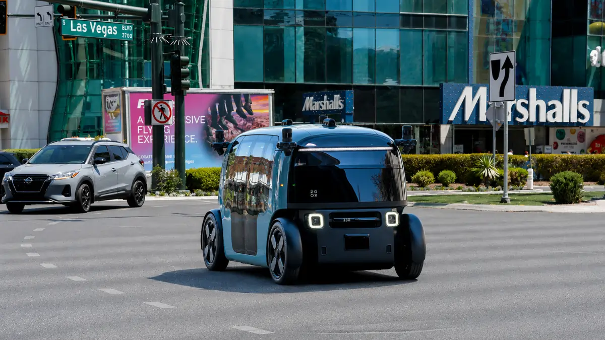A Zoox autonomous robotaxi operating on a public road in Las Vegas