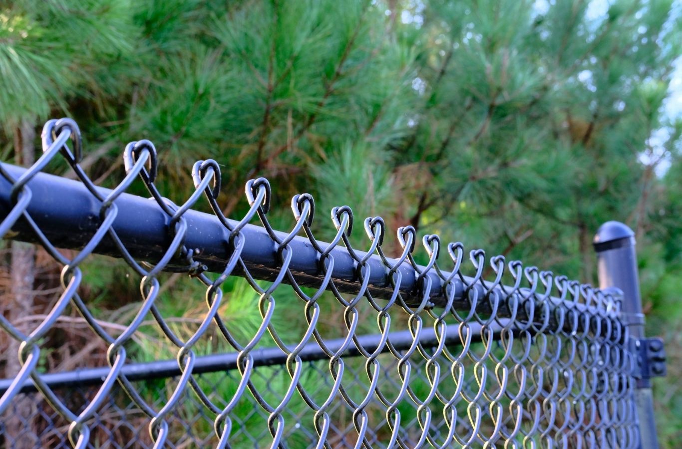 Fence Company of Columbus crew completing chain link fence installation in Gahanna, OH, focusing on security, durability, and efficient setup.