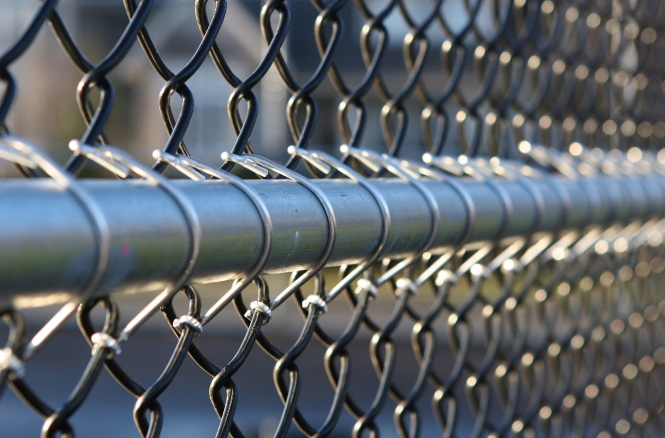 Fence Company of Columbus installer performing chain link fence installation in Gahanna, OH with accurate post setting and alignment. Chain Link Fence Installation Near Me.