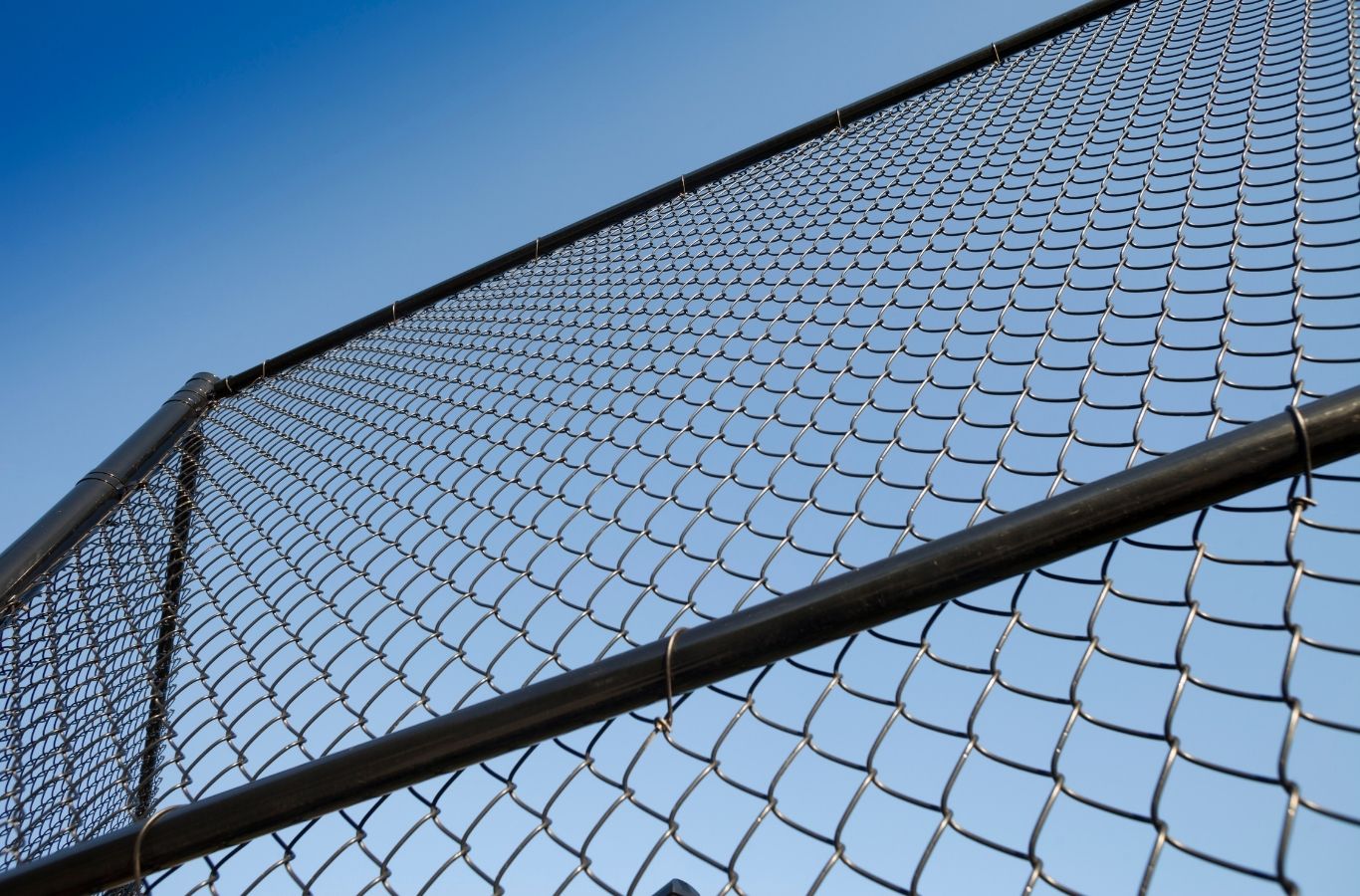 Fence Company of Columbus installer performing chain link fence installation in Worthington, OH with precise alignment and stable post setting. Chain Link Fence Installation Near Me.