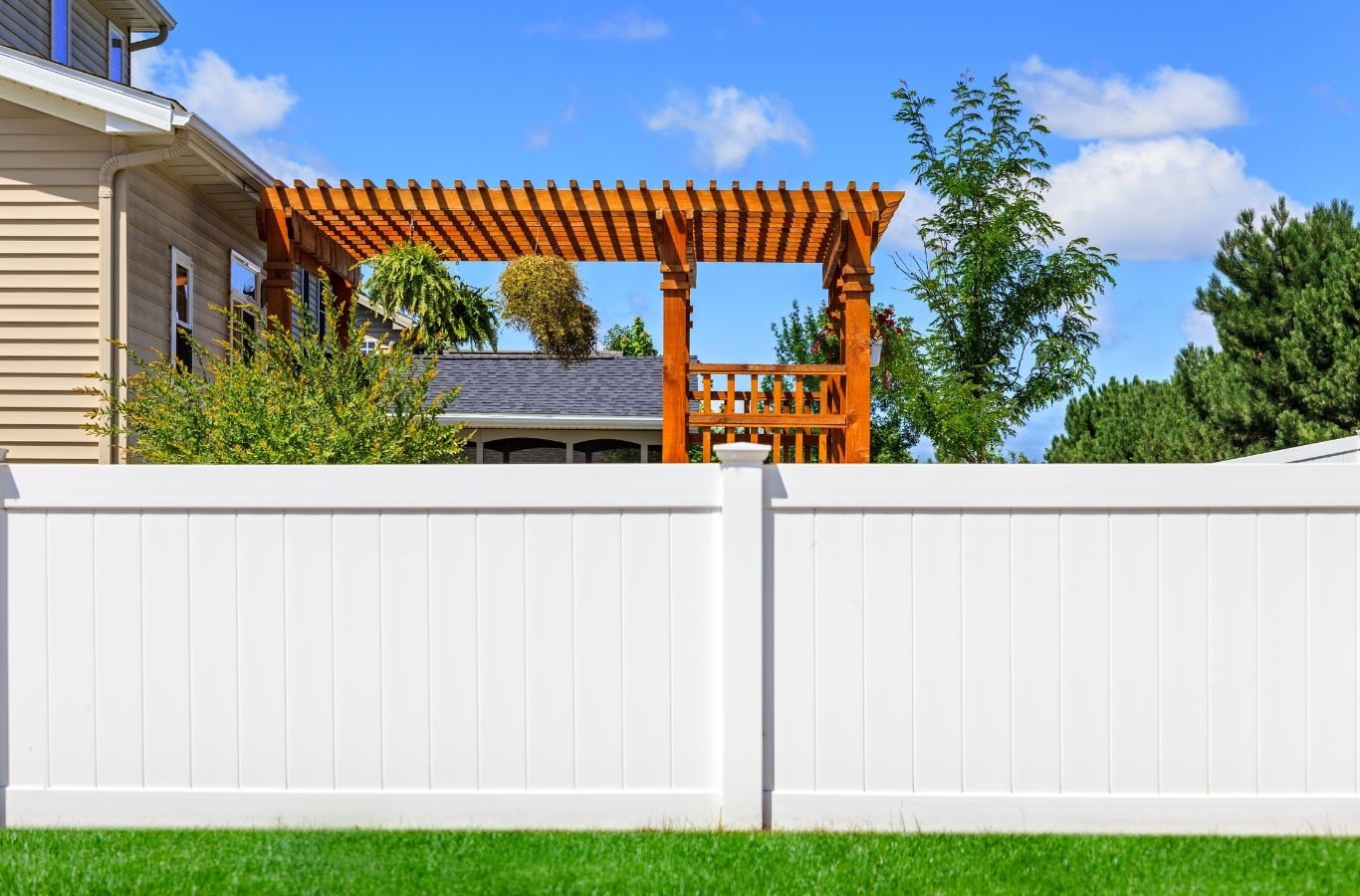 Fence Company of Columbus crew installing a vinyl fence in Gahanna, OH, highlighting privacy, durability, and low maintenance performance.