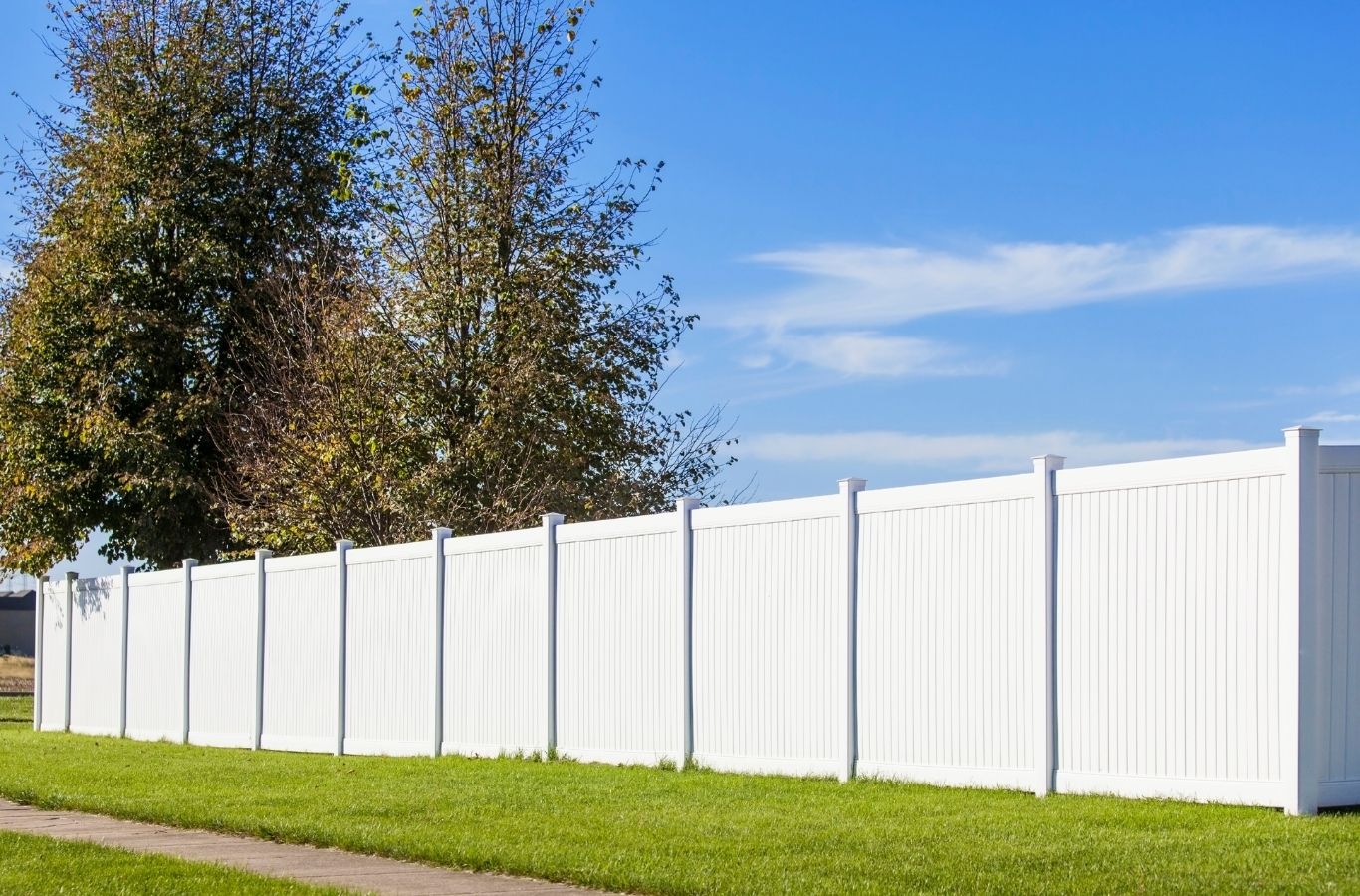 Fence Company of Columbus crew installing a vinyl fence in Grove City, OH, showcasing privacy, durability, and clean low maintenance design.