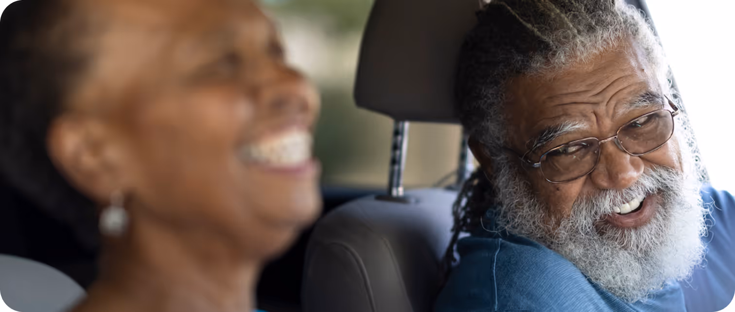 a couple of people in a car