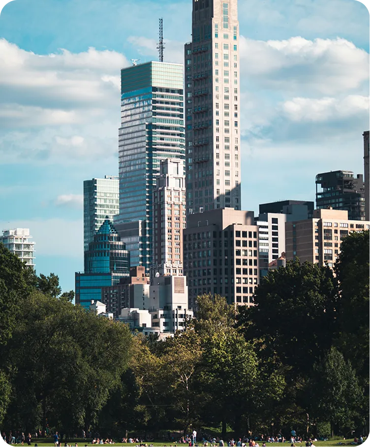 A city skyline with a large building in the foreground.