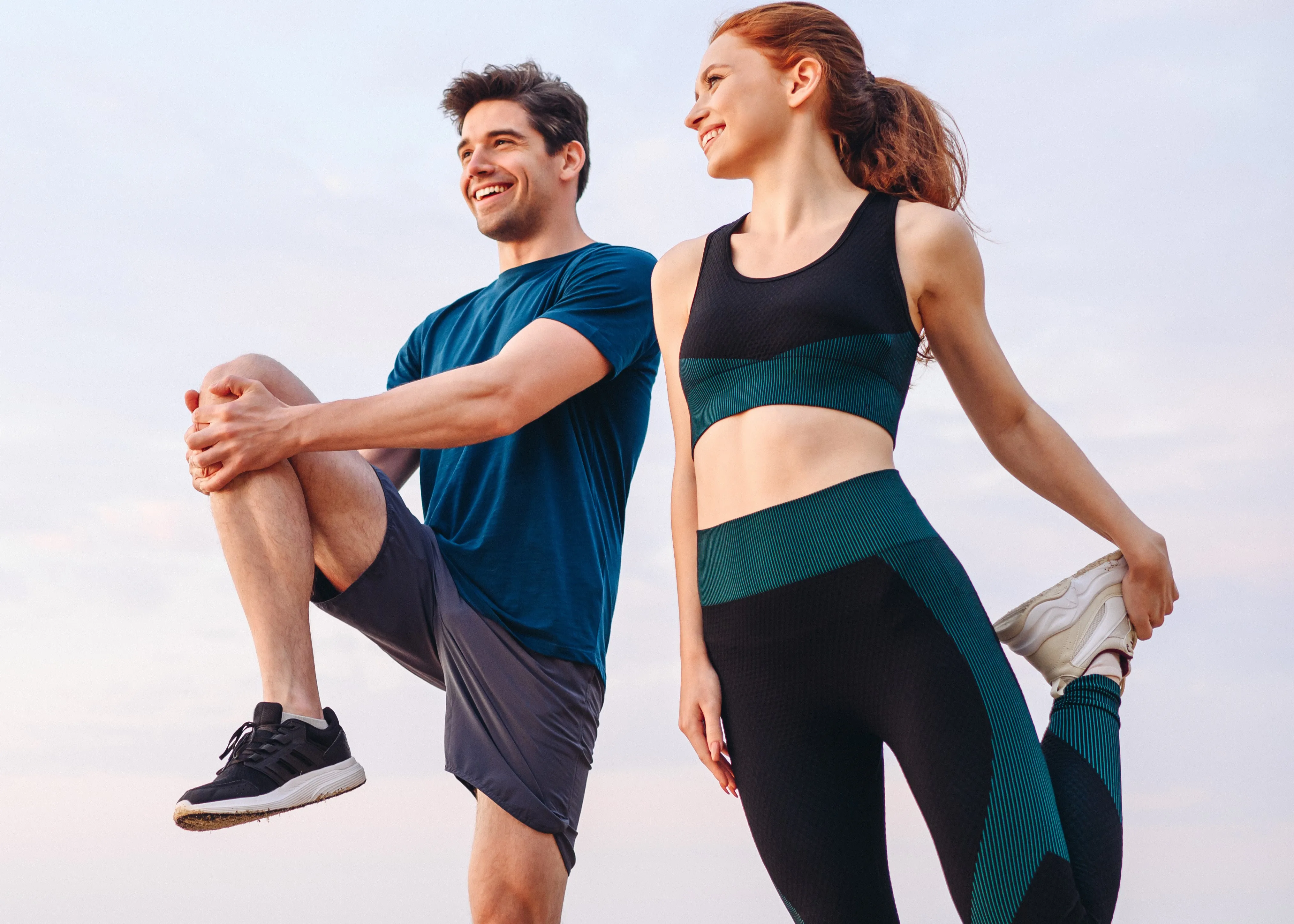 A couple stretching before a workout