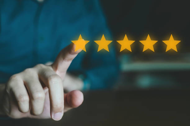 Person pointing to five stars representing positive client reviews and satisfaction