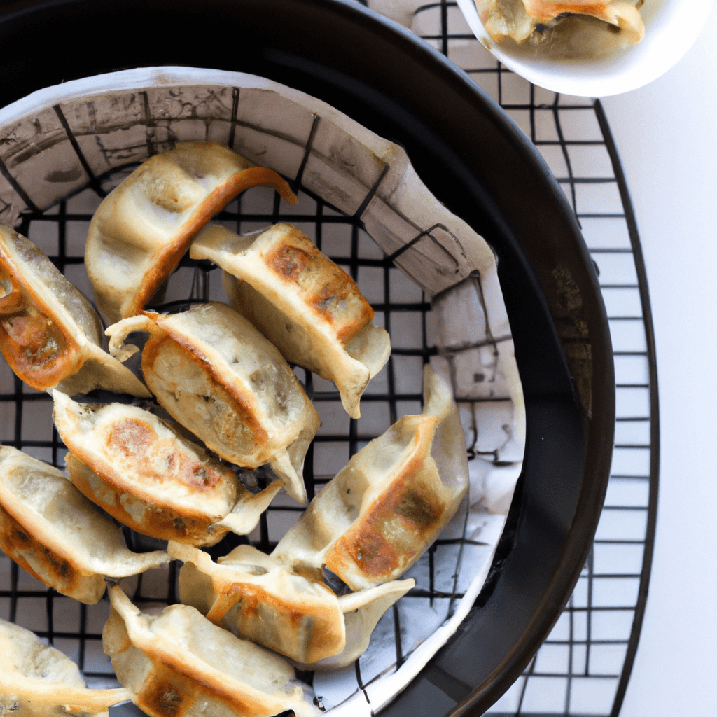 Golden brown gyoza in air fryer basket