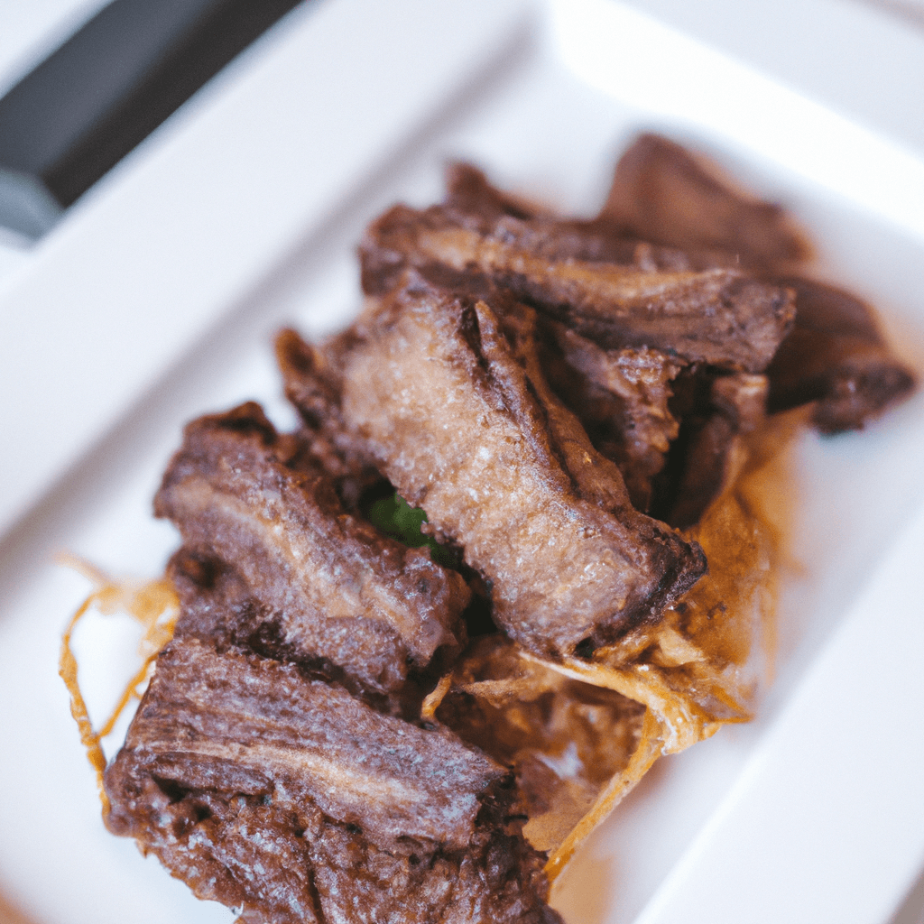 Air fryer basket with crispy cooked beef strips inside