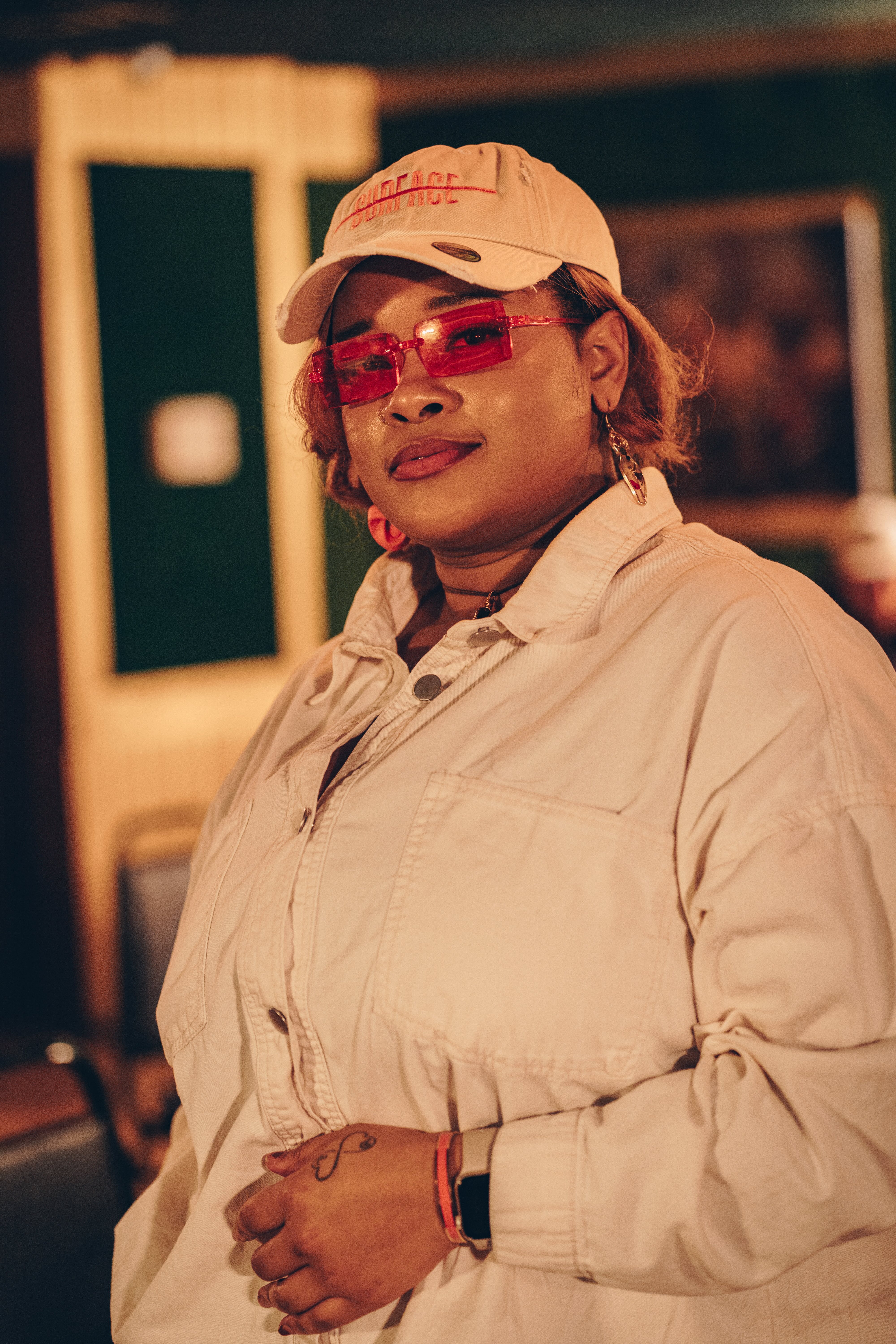 Artist, Senoj from the Roc, posed with hat on. Photo by Onis.