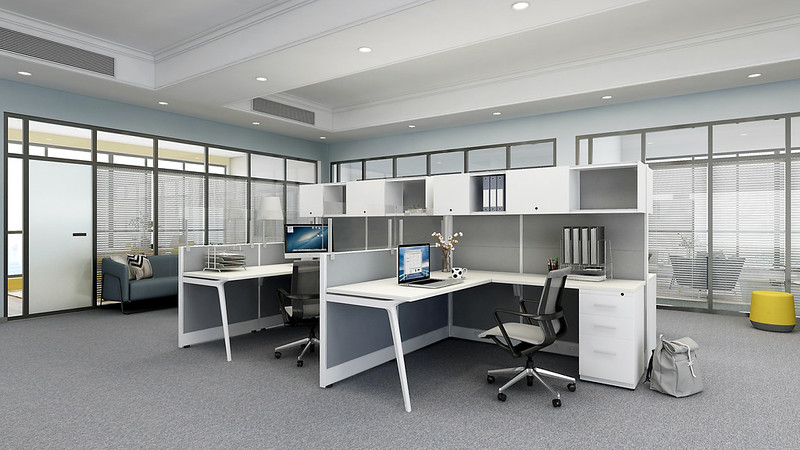 Friant L shaped workstations with overhead storage in a glass walled office