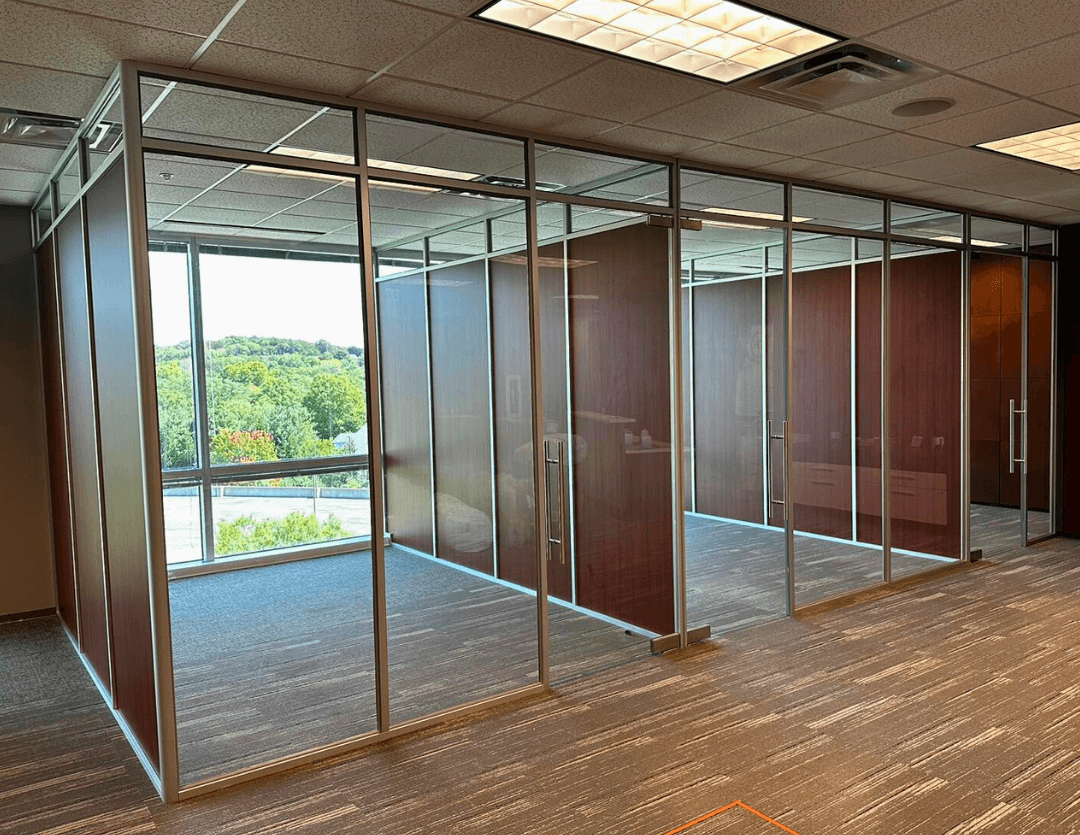 Teilen glass office fronts with wood veneer panels and window views