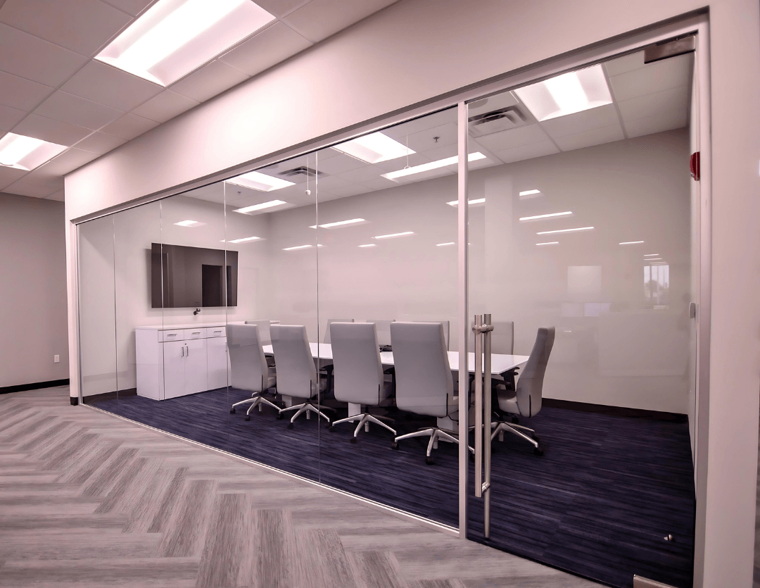 Teilen glass conference room front with sliding door in a corporate office