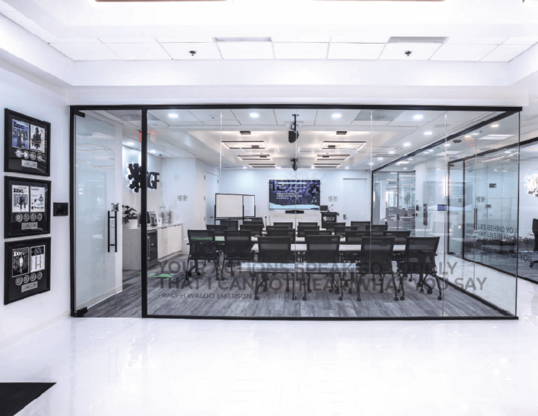 Teilen glass walled training room with full height sliding glass doors