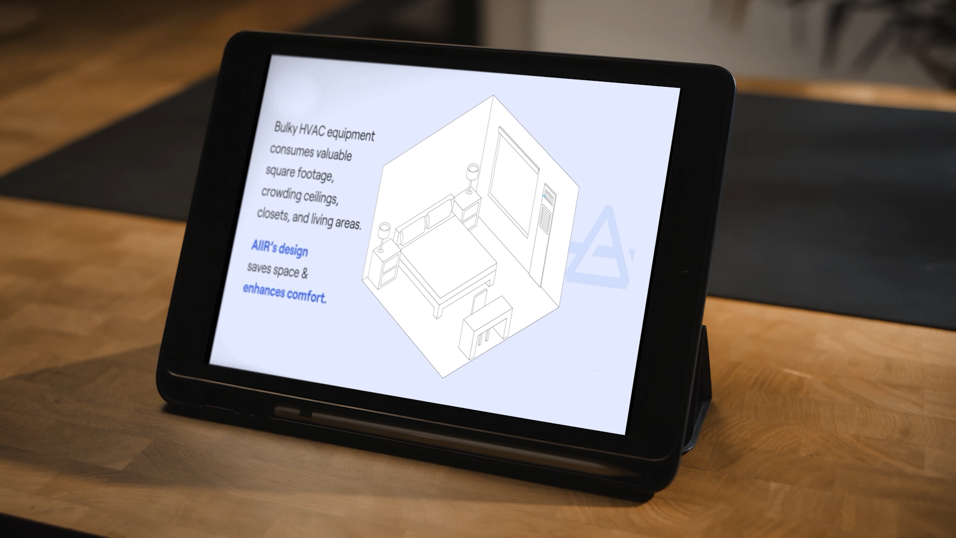 Tablet screen showing a diagram of a bedroom with compact HVAC unit and text about Aiir’s design saving space and enhancing comfort.
