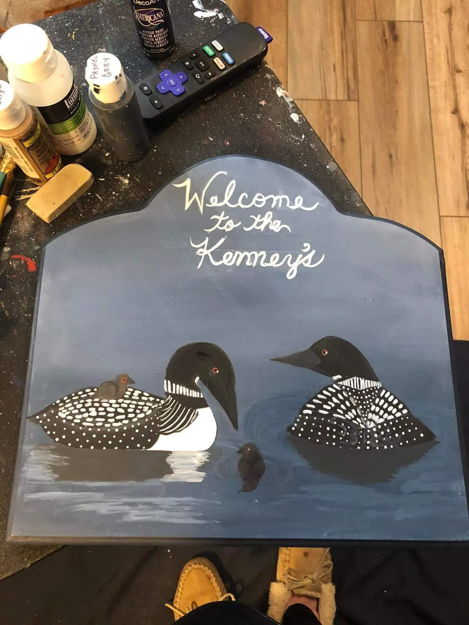 Custom wood sign featuring two painted loons and baby chicks with the words "Welcome to the Kenney’s."