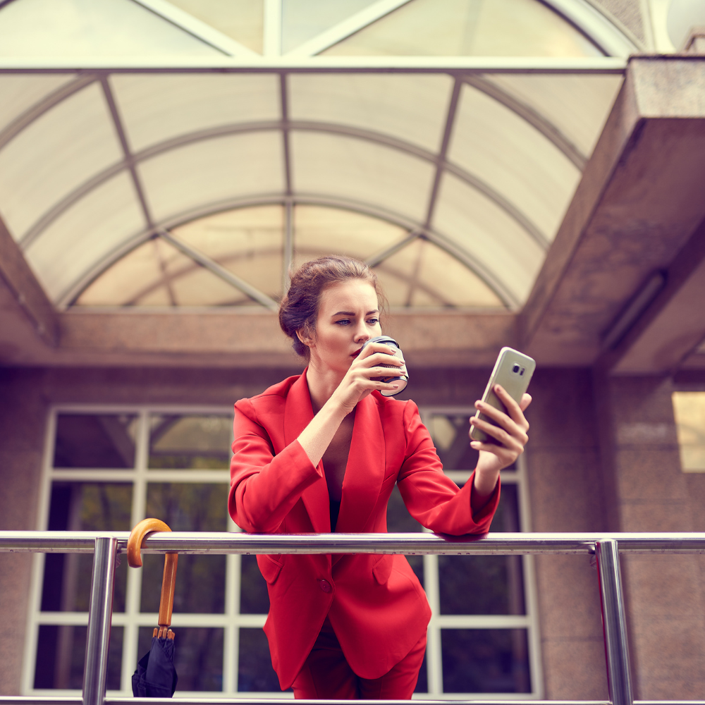 Professional Woman Drinking Coffee on Phone