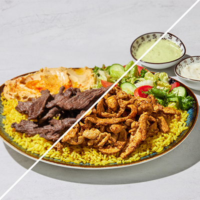 Tender chicken shawarma with rice, salad, and pita bread at The Green Olive.