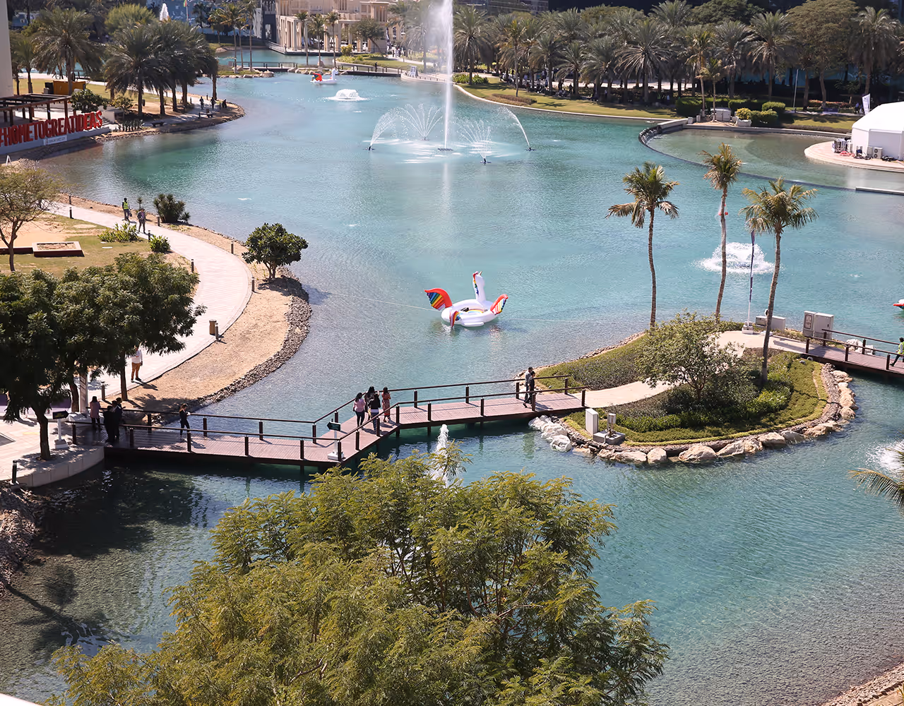 Scenic lake walkway near Dubai Outsource City campus