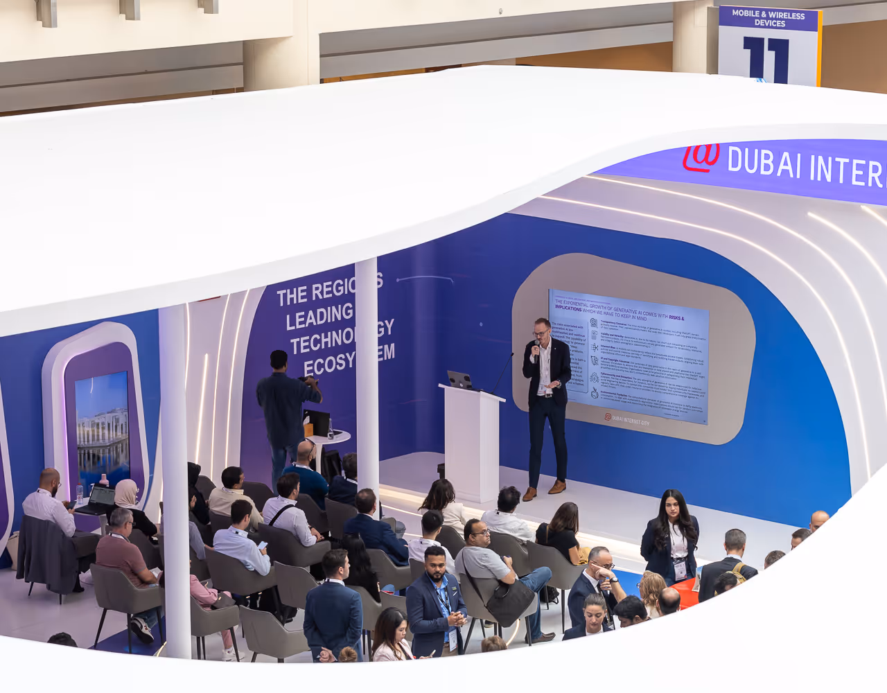 Speaker presenting at a technology ecosystem seminar in Dubai Outsource City