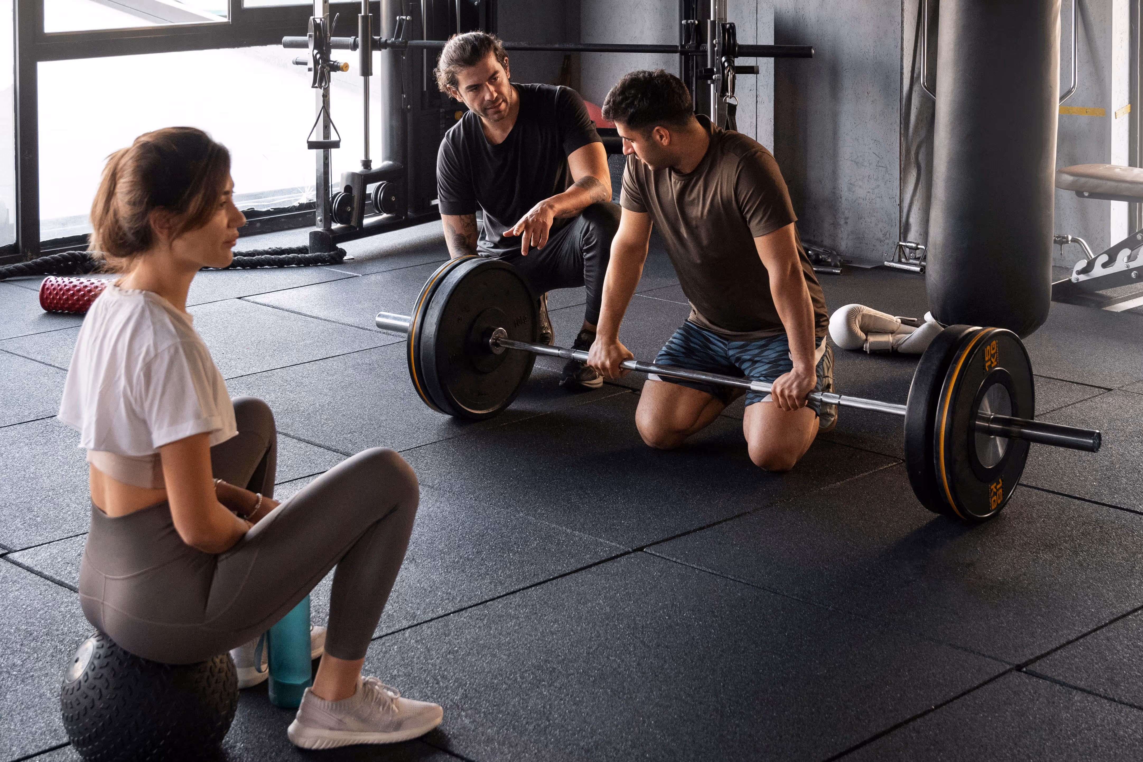 a coach and a weight lifter discussing