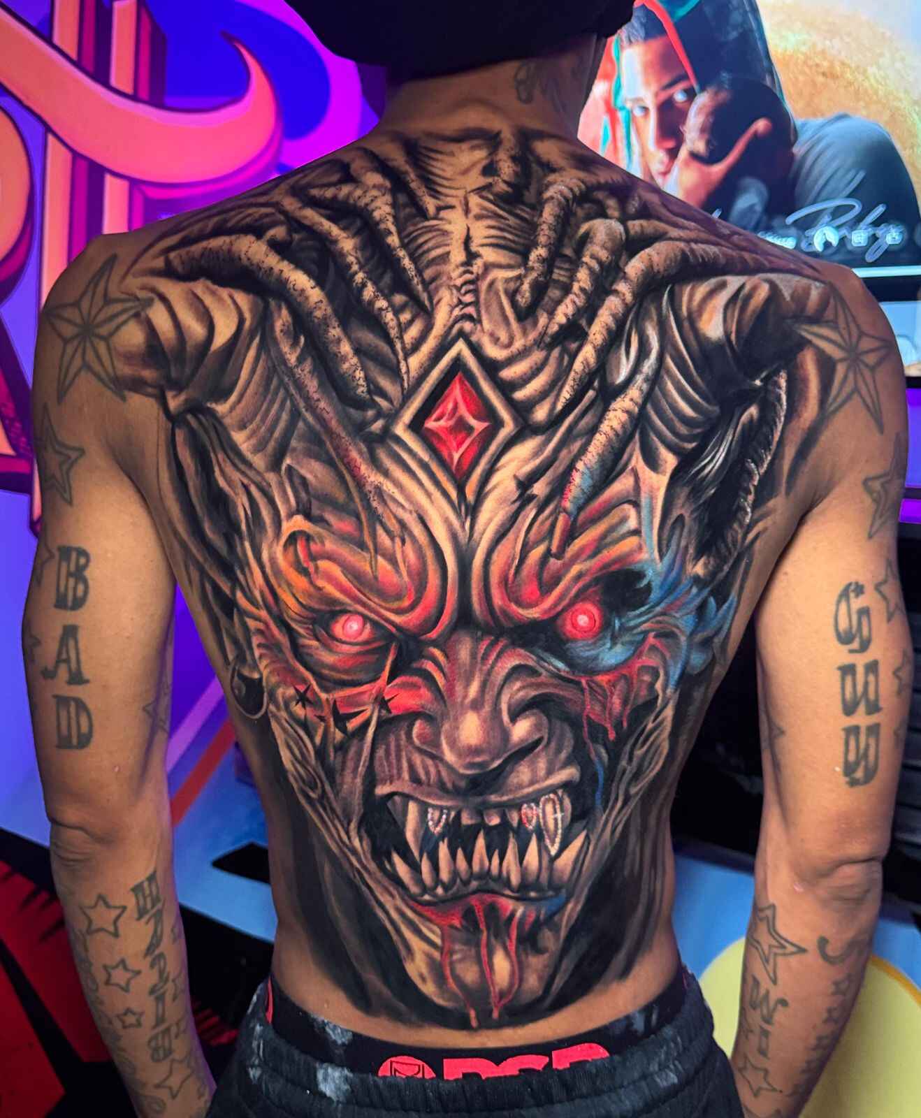 image of artist creating a tattoo