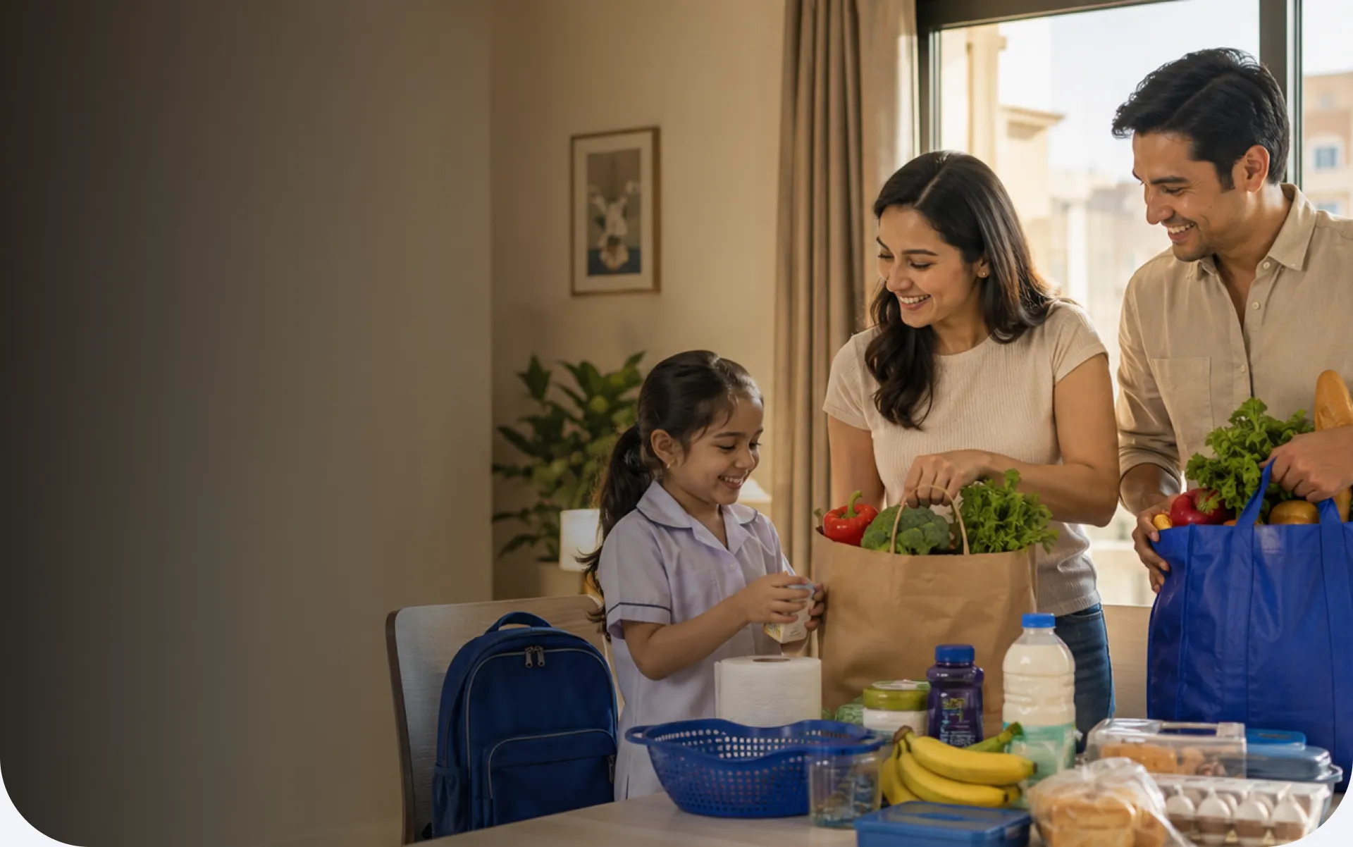 Family unpacking groceries at home