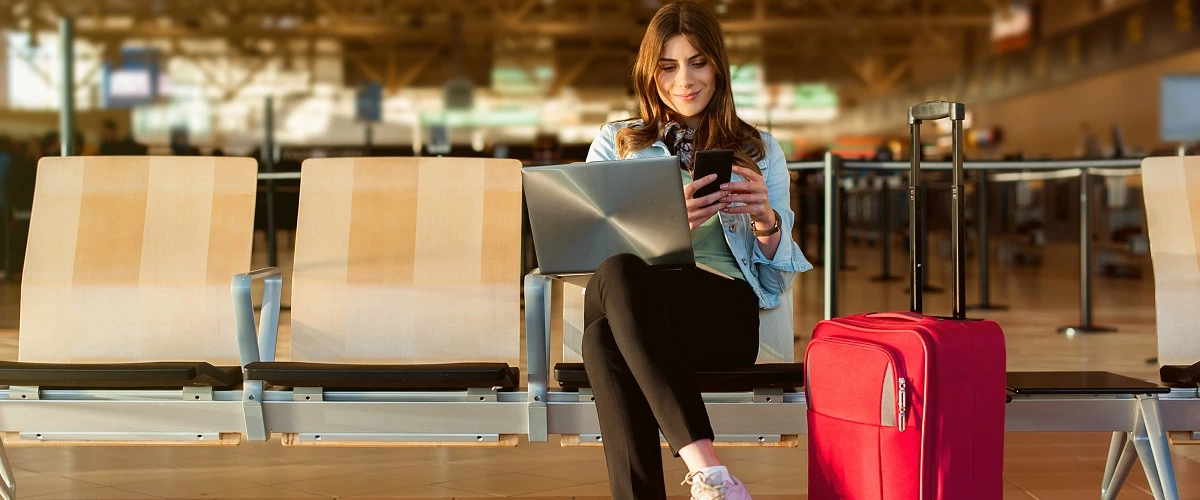 Student with Luggage in Airport 