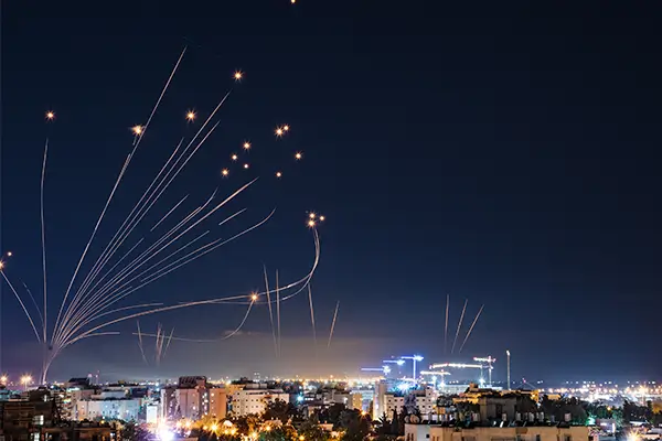 Israel's Iron Dome Air Defense System shoots dozens of rockets into the night sky over Israel to intercept incoming rockets and artillery shells in the Israel/Gaza conflict