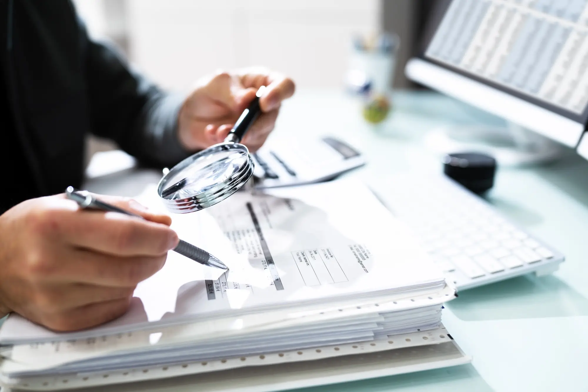 An auditor carefully examines data to ensure it is accurate and free of manipulation