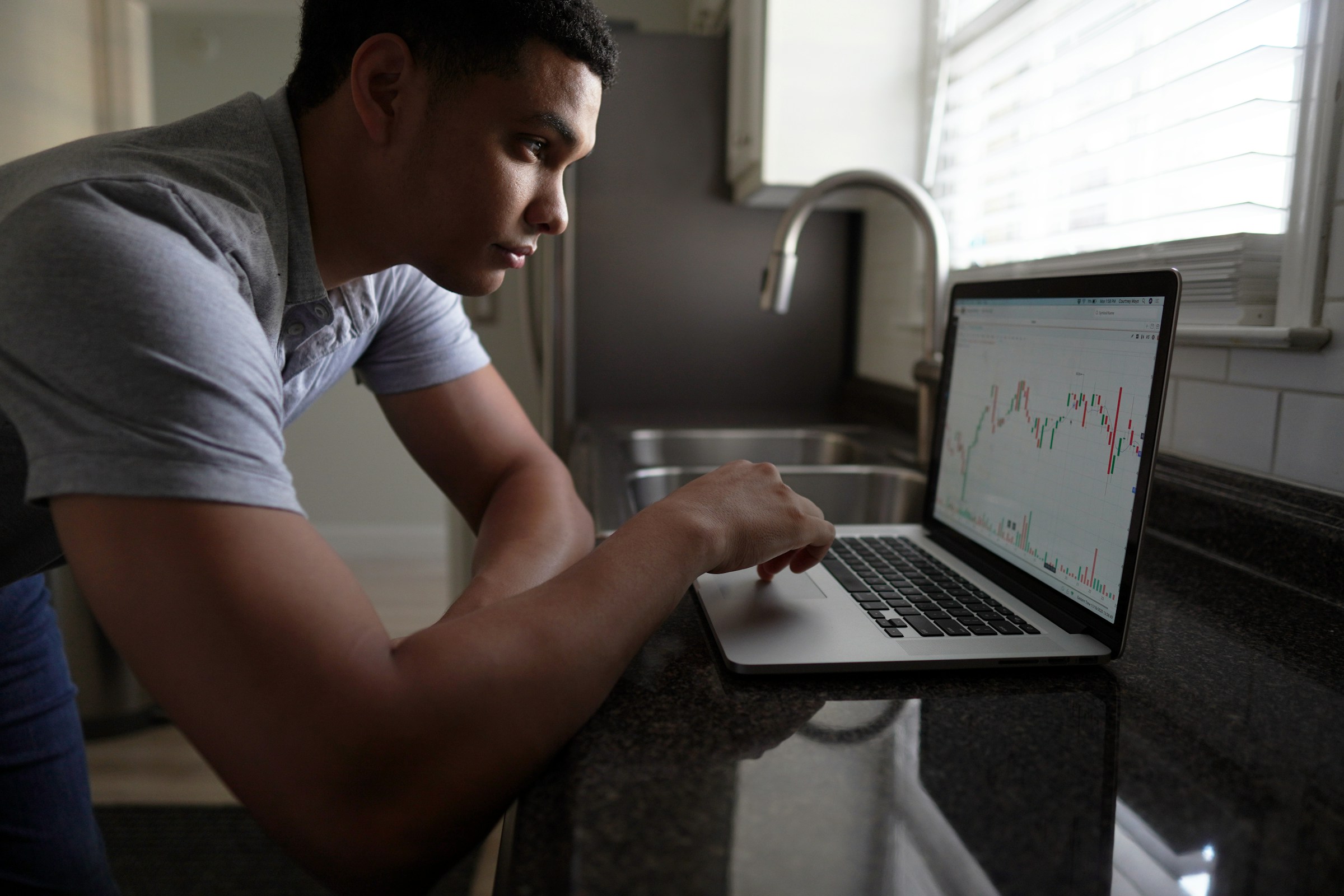Man Trading on Lap