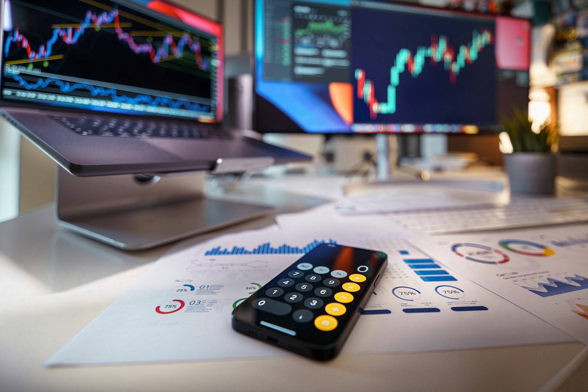 trading apps on laptop screens - Forex Prop Firms