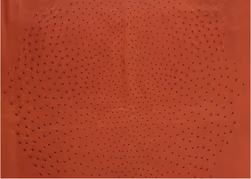 A red textured background with a pattern of small purple dots arranged in a radial design. The surface appears smooth with a glossy finish, showcasing the contrast between the dots and the red background.