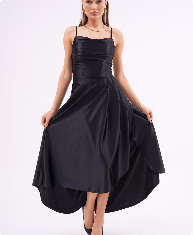 Model in black satin Celestera gown with spaghetti straps and asymmetric high-low hemline – Farika eveningwear