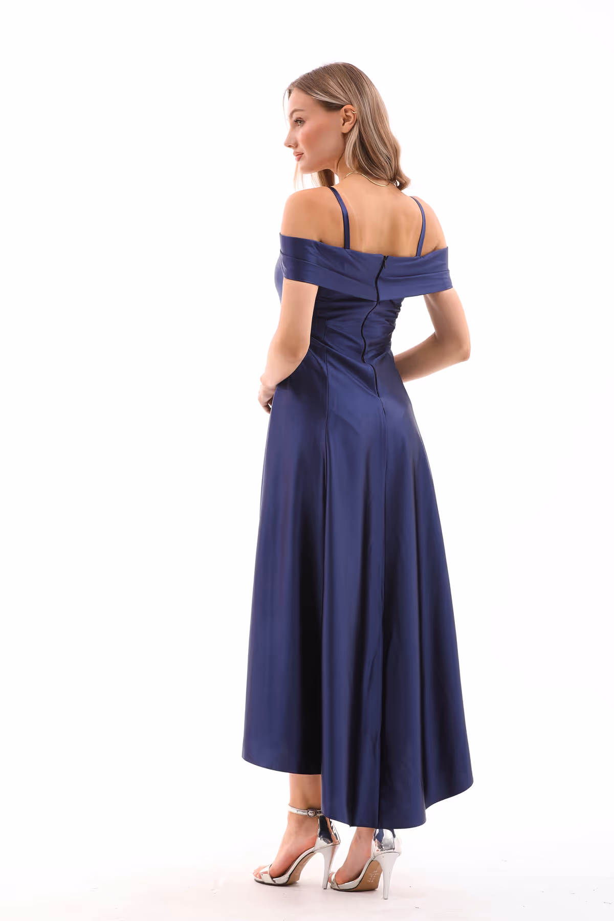Back view of the Valeria navy gown, showing the structured bodice, zipper closure, and off-shoulder sleeve design.
