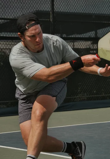 man hit pickle ball