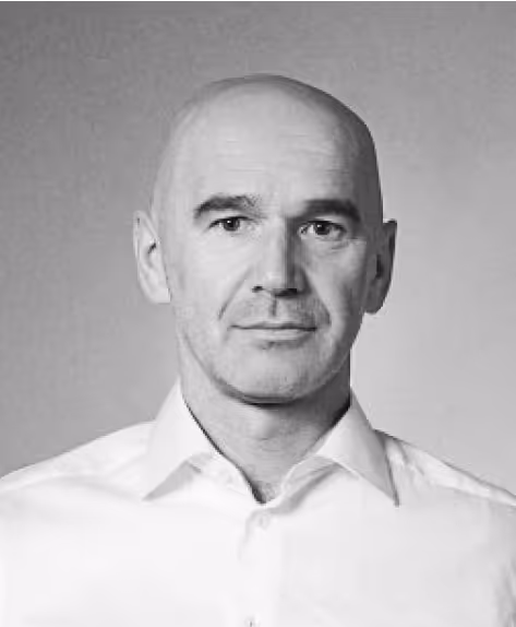 A B&W portrait of a smiling men. Marek Salak