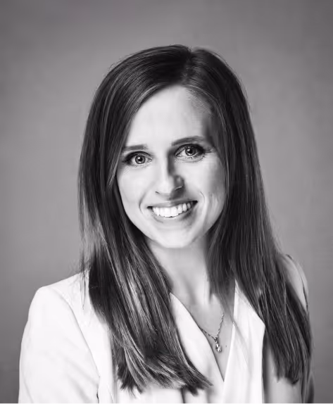 A B&W portrait of a smiling woman Karolina Korczak