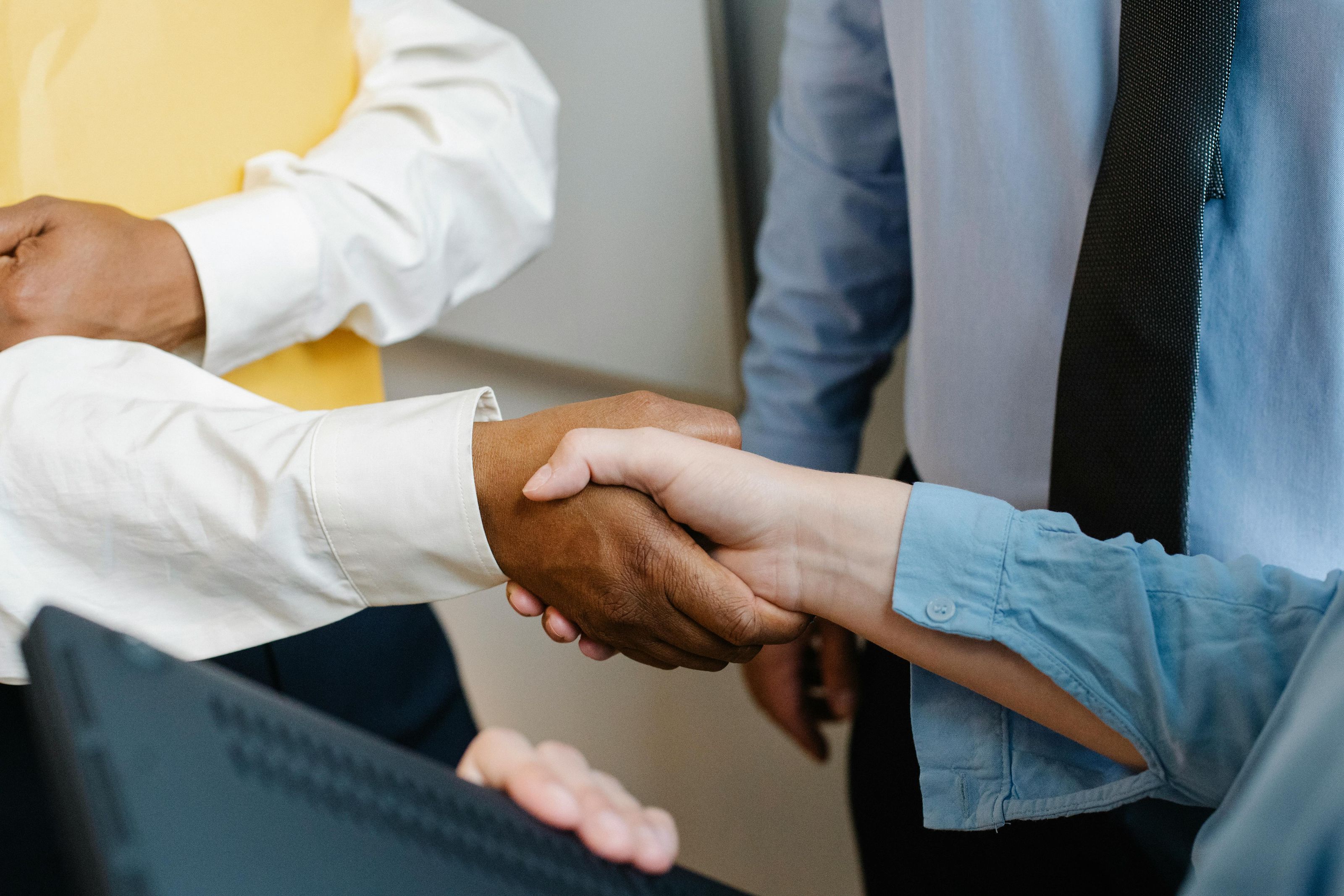 Smiling professional shaking hands to seal a trusted business partnership
