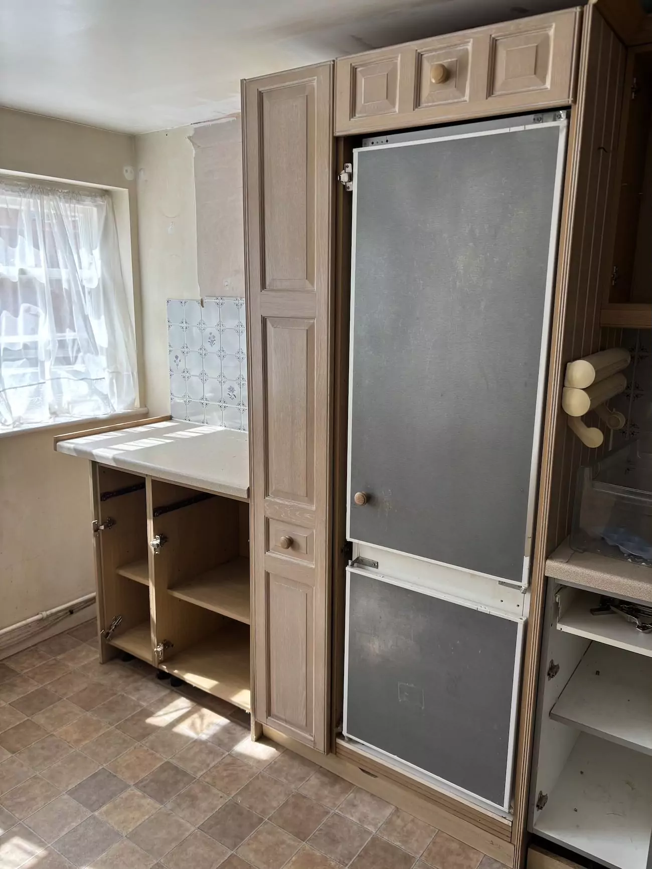 Dated wooden kitchen cabinets in old house