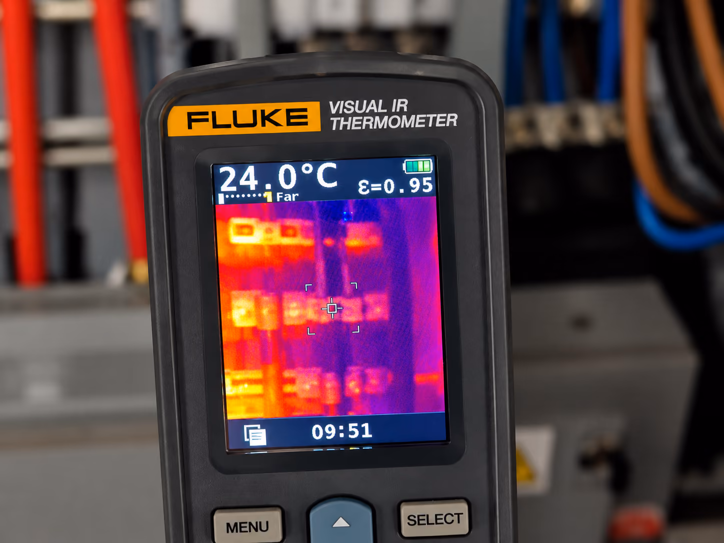 Fluke Visual IR Thermometer displaying a thermal image with temperature reading of 24.0°C and emissivity of 0.95, showing heat distribution in an electrical panel.