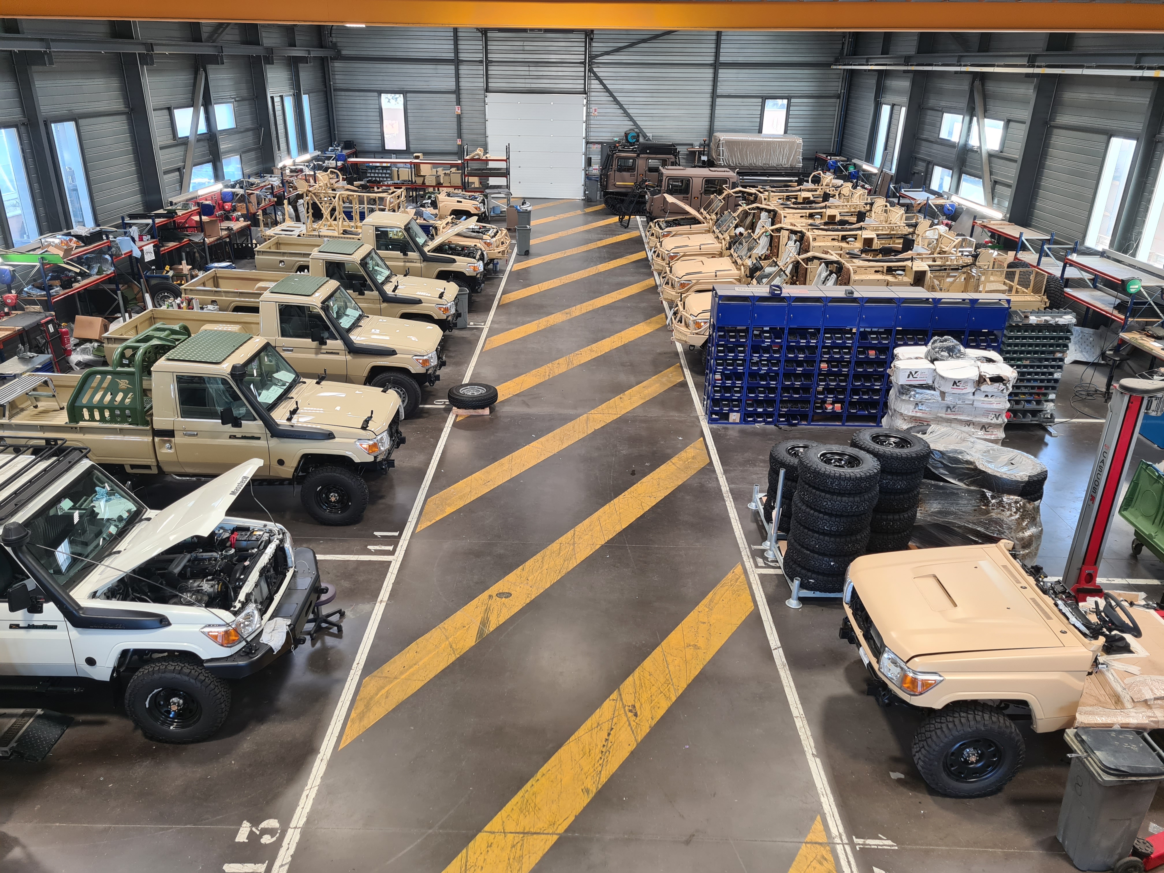 Technamm workshop with military vehicles in preparation.