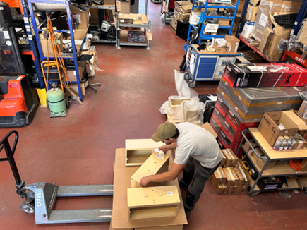 Technamm employee packing parts in the Miramas workshop.