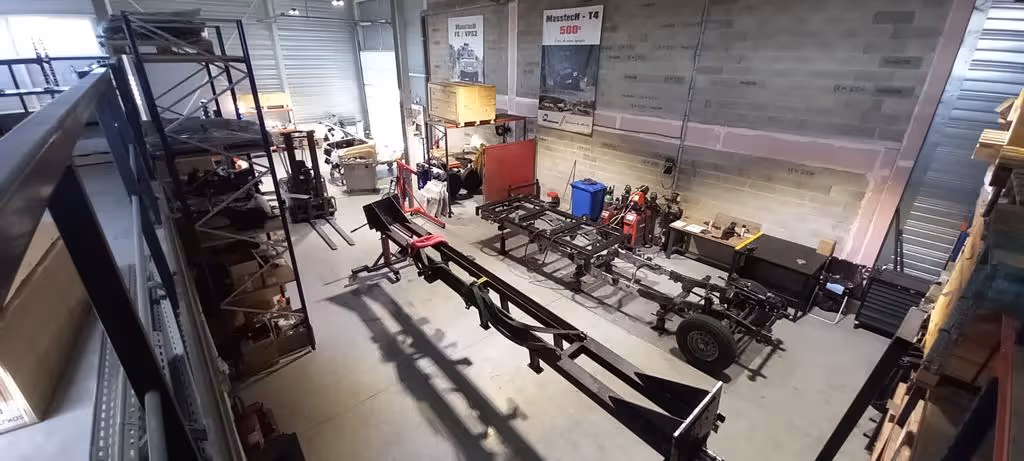 Technamm workshop with chassis and equipment being assembled.
